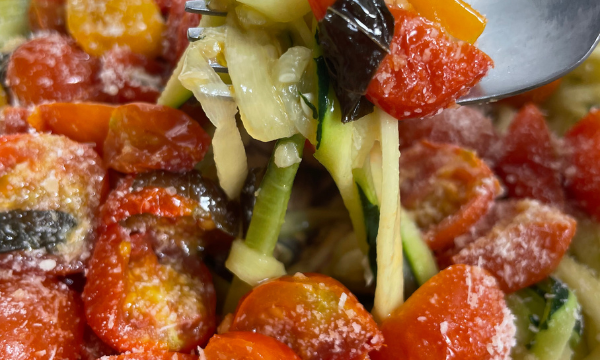 fork in roasted tomato zucchini pasta